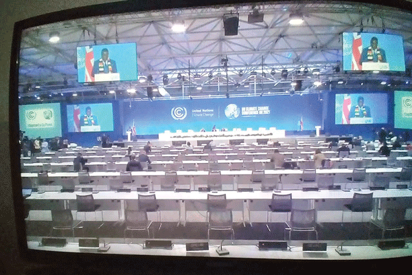 Empty chairs as ED addresses COP26