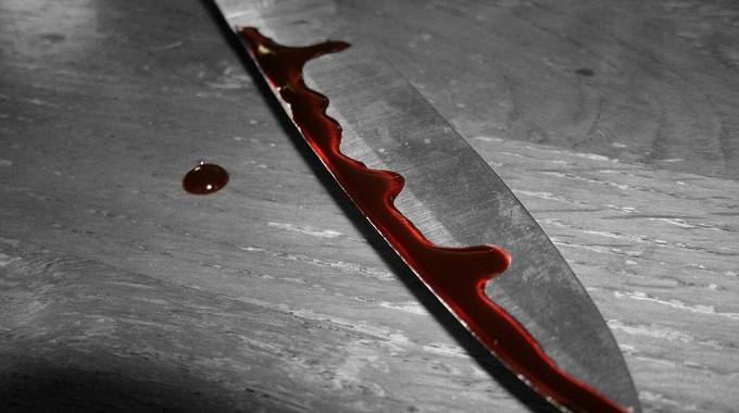Girl (15) buried with knife lodged in body